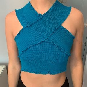 Blue crisscross crop top. Stretchy.